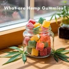 Jar of colourful hemp gummies near a window with the heading What are Hemp Gummies?